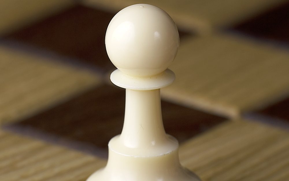 White chess pawn representing Pawn Chess Club pop-up events